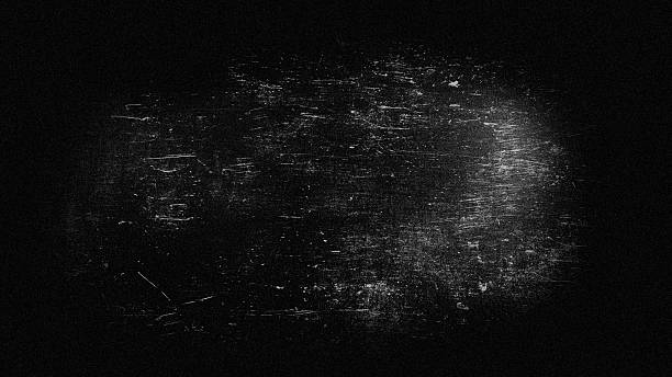 istock Abstract blurred grainy background, light scratches on dark gray in a black frame. 2245373263
