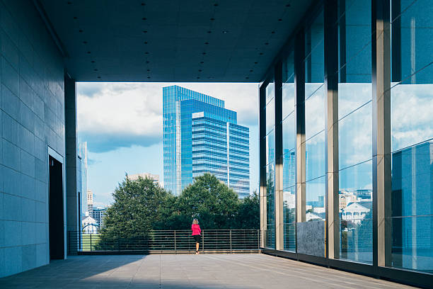Mature businesswoman walks in large office park