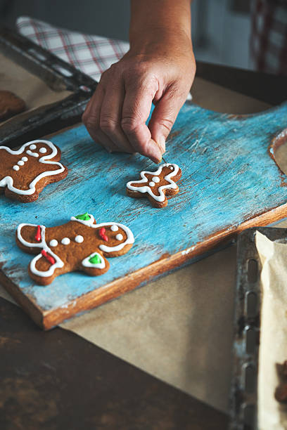 istock Baking Gingerbread Christmas Cookies in the Oven 2245374047