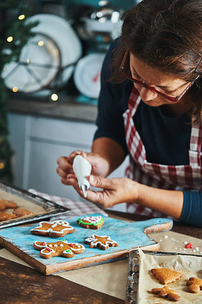 istock Baking Gingerbread Christmas Cookies in the Oven 2245374124