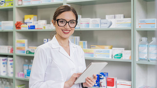 istock Woman pharmacist checking medicine inventory using digital tablet 2245376287