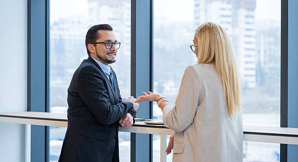 istock Engaging conversation in office space showcasing professionalism and connection between colleagues. 2245376334