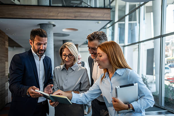 istock Business professionals discussing project ideas in modern office 2245376650