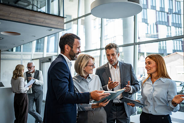 istock Business colleagues collaborating during a corporate office meeting 2245376754