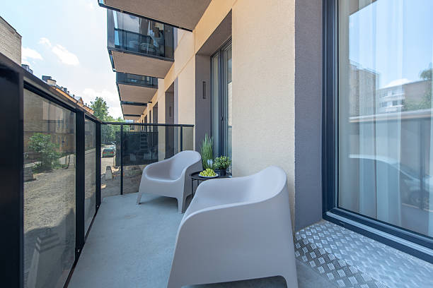 istock Modern Balcony with Minimalistic Seating and Urban Views 2245377538
