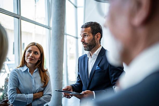 istock Business team collaborating discussing ideas in modern office 2245378741