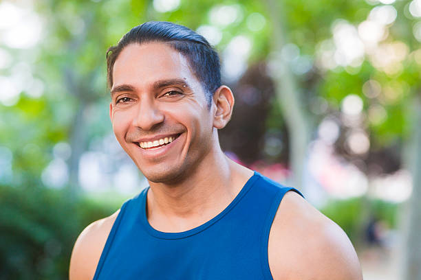 istock Venezuelan athlete smiling, looking at camera in a park 2245379534
