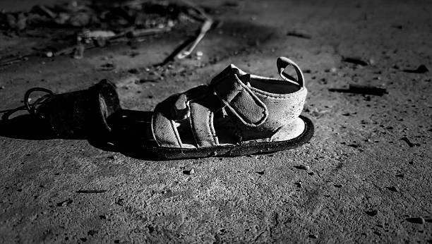 isolated children's pink summer sandals on a white background
