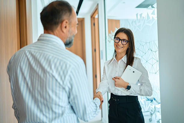 istock Business people shaking hands welcoming a new partner 2245383277