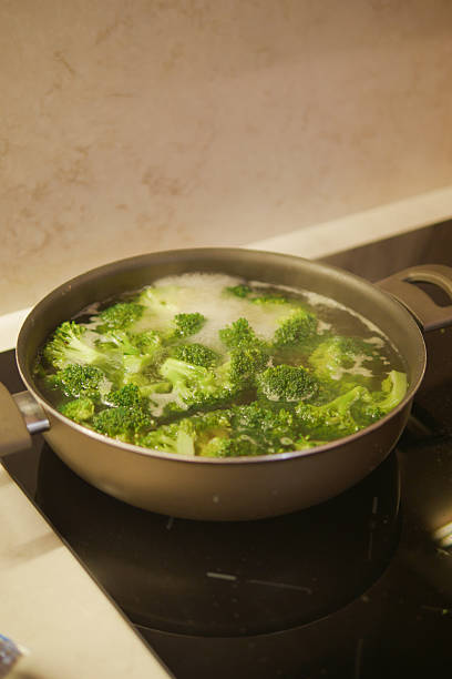 istock Cooking fresh broccoli in a pot on the stove 2245385602