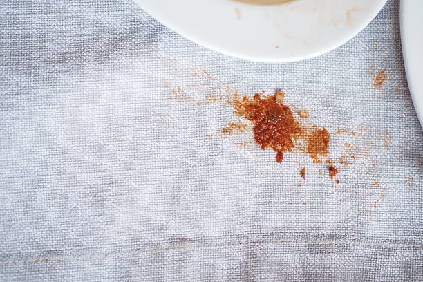 istock Stain on a tablecloth from spilled food or sauce 2245387910