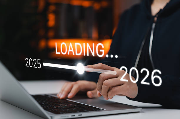 istock Progress and Transition From 2025 to 2026 Concept. Person pointing to loading bar transitioning from 2025 to 2026, annual planning, and business growth. future planning, challenge, and new year goals. 2245388228