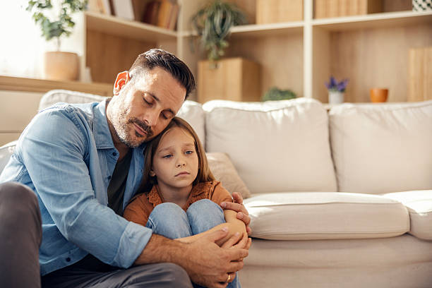 istock Father comforting sad daughter at home 2245390949