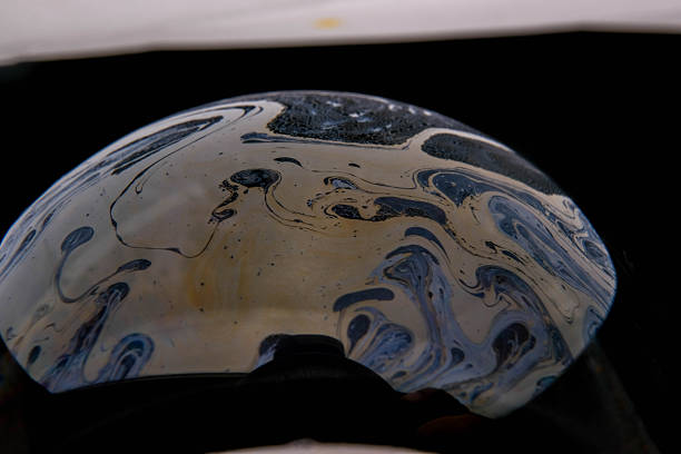 A close-up shot of soap bubbles with water.