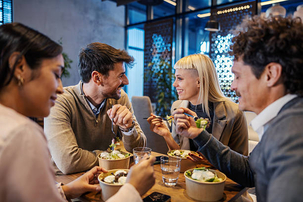 istock Business colleagues having healthy lunch break in restaurant 2245391580