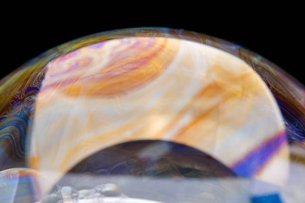 closeup photo of colored light reflection on the surface of soap bubble