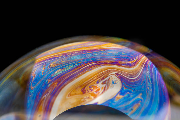 istock closeup photo of colored light reflection on the surface of soap bubble 2245392012