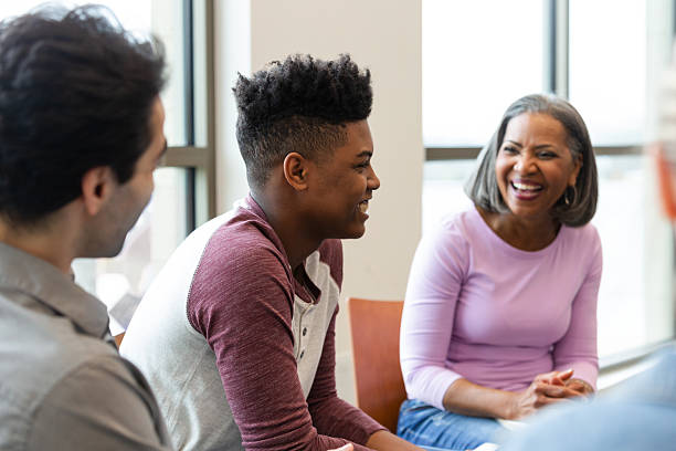 istock Diverse group of people engaged in a lively conversation indoors. 2245393260