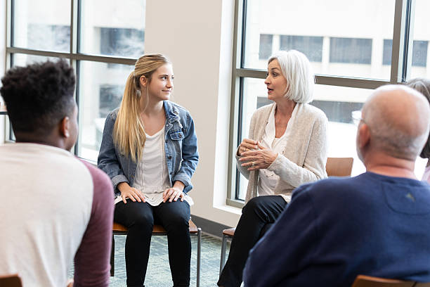 istock Group therapy session promotes understanding and support among diverse participants 2245393354