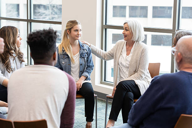 istock Supportive group leader offers encouragement and guidance during a counseling session. 2245393370