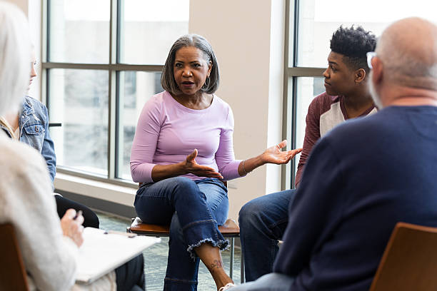istock Diverse group engaged in a discussion, sharing thoughts and feelings in a safe space. 2245393377