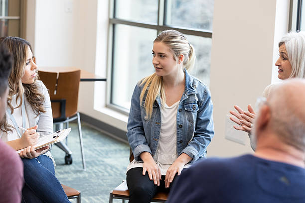 istock Diverse group in discussion, fostering connection and emotional support in a professional setting. 2245393411