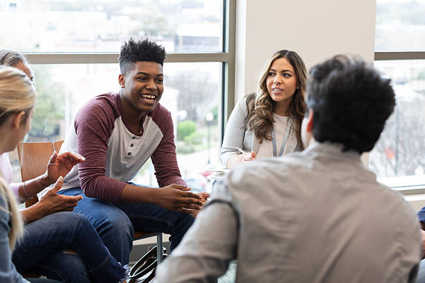 istock Diverse group of adults engaged in a supportive and insightful group therapy session discussing shared experiences 2245393435