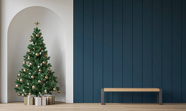 istock Modern minimalist interior decorated for Christmas, with a modern bench in front of deep blue wooden slat / shiplap wall, a Christmas tree with presents in a wall niche, near a window 2245396884