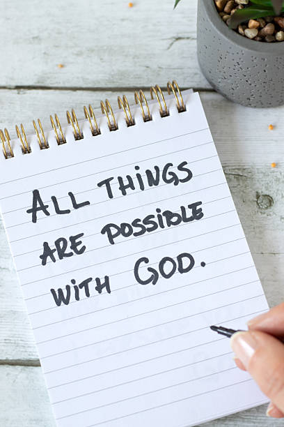 istock All things are possible with God, inspirational handwritten message in a notebook with mustard seeds 2245397795