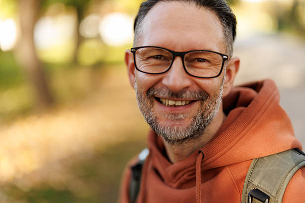 istock Mature man enjoying relaxing walk in autumn nature 2245399992