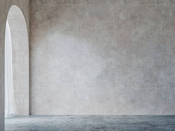istock A minimalist simple unfurnished interior with a weathered wall, on concrete floor, arched doorway /window with curtains 2245400375