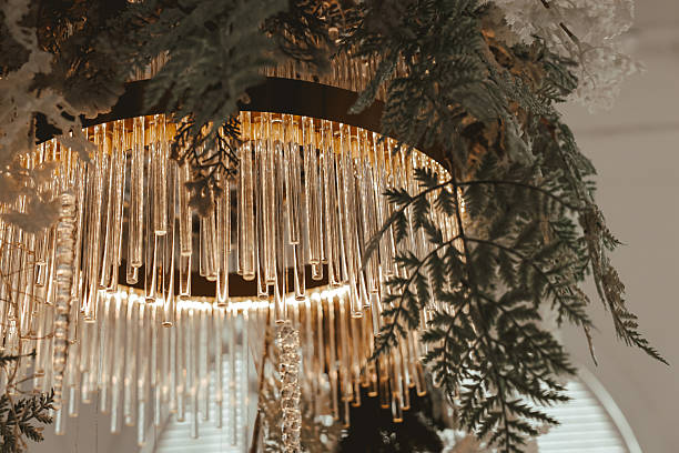 istock Modern chandelier design featuring crystal tubes and greenery for stylish decor 2245401880