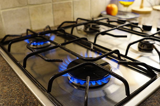 istock Gas Stove with Two Blue Flames in Kitchen 2245402193