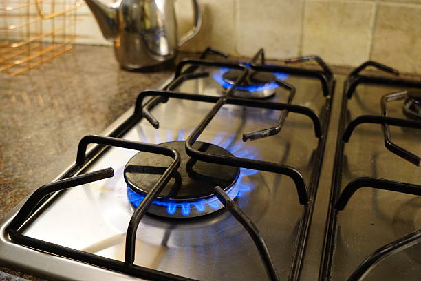 istock Gas Stove with Two Blue Flames in Kitchen 2245402205