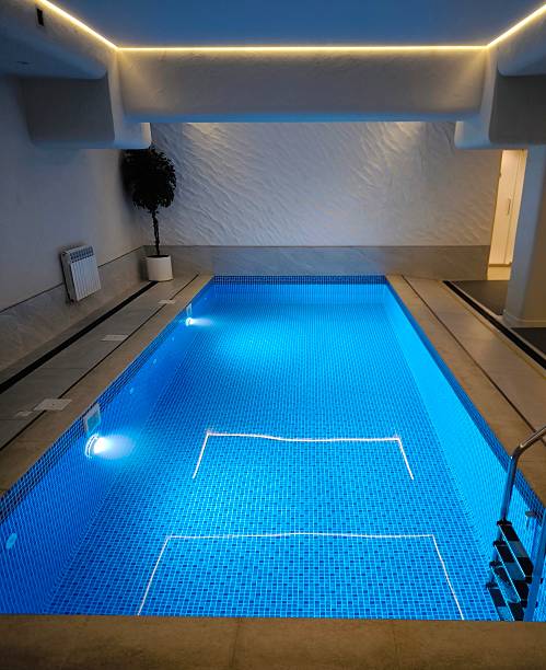istock A modern indoor pool with blue lighting in a minimalist interior 2245402943