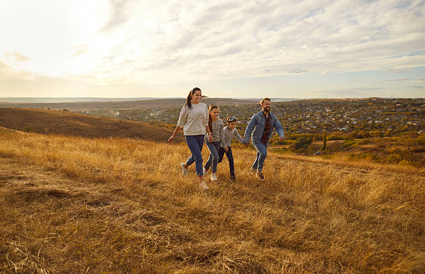 istock Happy Family Enjoying Nature During Vacation 2245408355