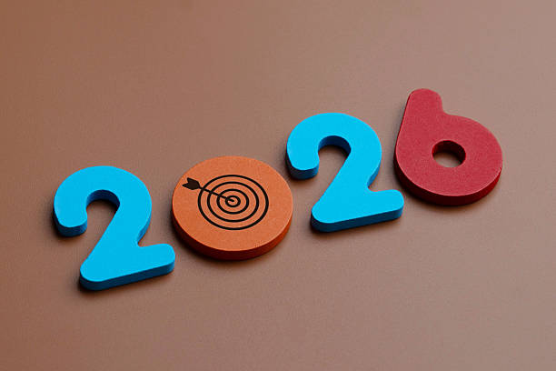 istock Colored wooden numbers and a target symbol form 2026. 2245410830