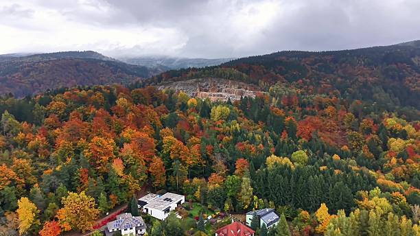 istock Hillside community with colorful rooftops beneath overcast skies 2245412947