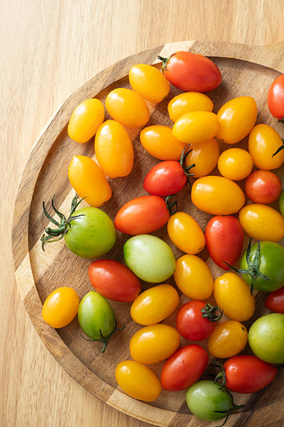 Green, red, and yellow cherry tomatoes