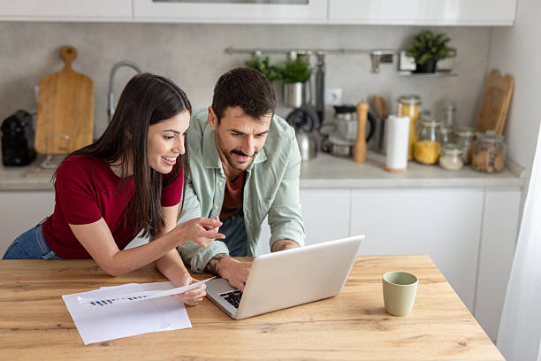 istock Couple celebrating their creativity in a modern kitchen. 2245422839