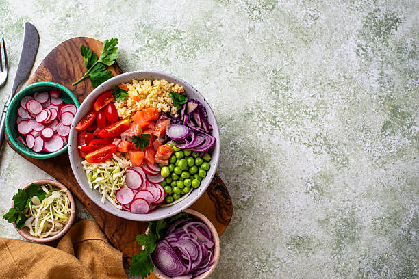 istock Balanced healthy bowl with vegetables and salmon 2245423283