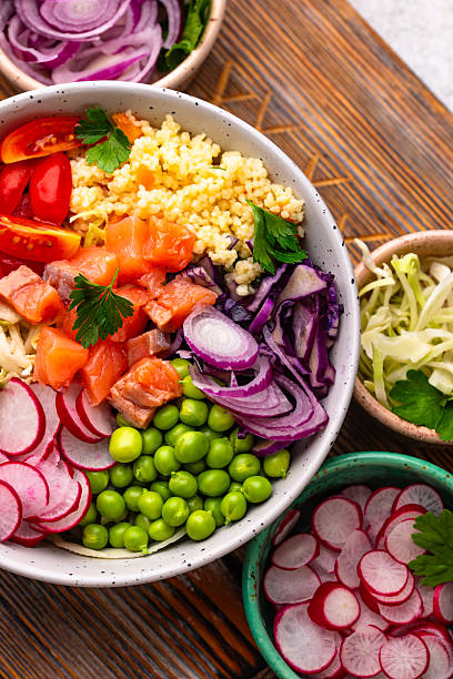 istock Balanced healthy bowl with vegetables and salmon 2245423330