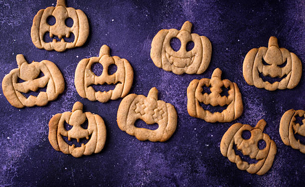 istock Halloween cookies in shape of jack-o-lantern 2245423338