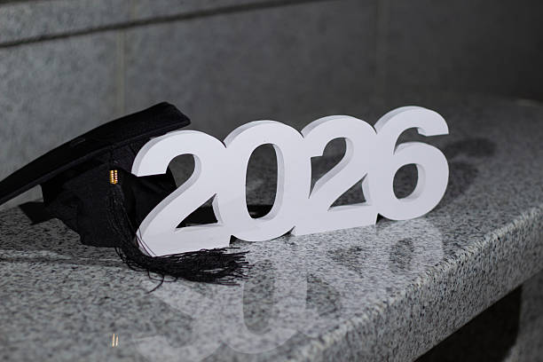 istock Graduation Cap and Year 2026 Displayed Together on a Shiny Surface 2245425151