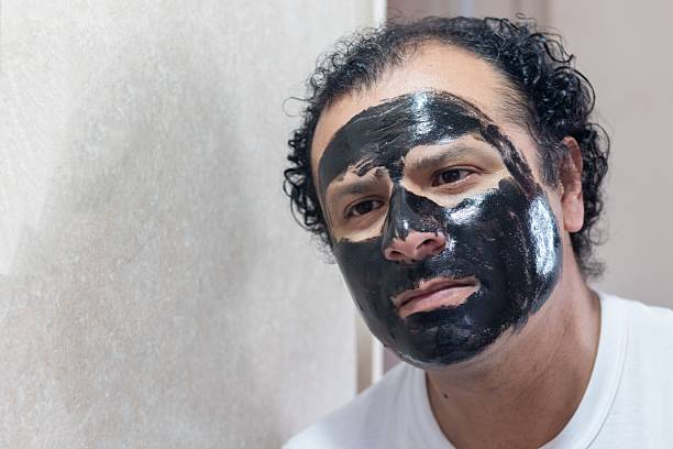 istock man in front of the bathroom mirror 2245429625