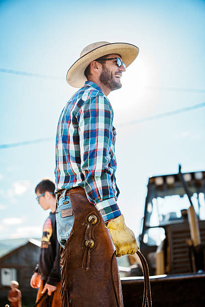 istock Smiling Rancher Working on Farm with Tween Son 2245430192