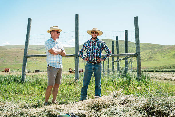 istock Ranchers Discussing Summer Hay Harvest 2245430415