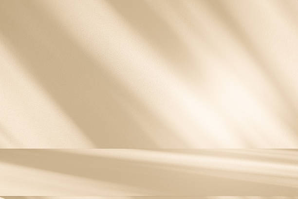 istock Studio style background wall decoration presentation uses white and beige tones. with shadows cast from a nearby window, concept creating a decorative 2245431286