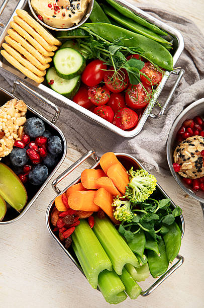 istock Boxes containing fresh fruits, vegetables, sandwiches, and nuts. 2245431973