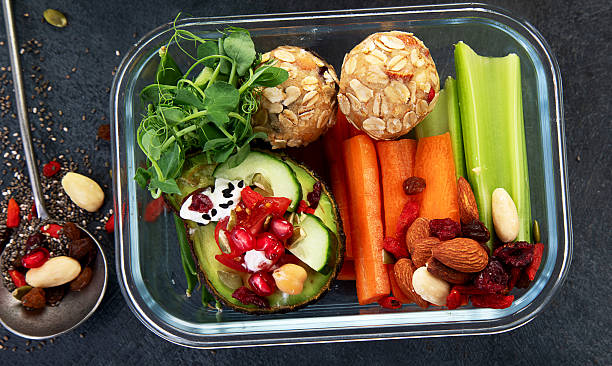 istock Bbox containing fresh fruits, vegetables, sandwiches, and nuts. 2245432200